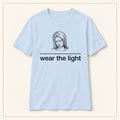 Minimal Inspirational T-Shirt — Wear the Light — compact lay-flat, original print scale and placement — Light Blue