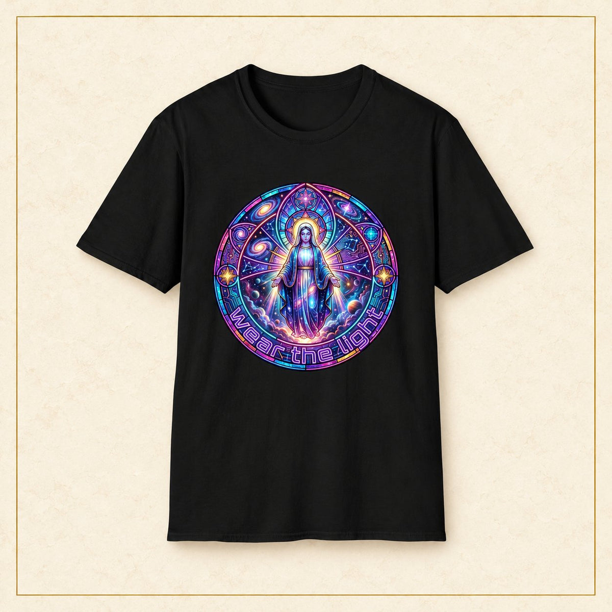 Mystic Madonna T-Shirt — Cosmic Stained Glass — black shirt on warm limestone with gold frame