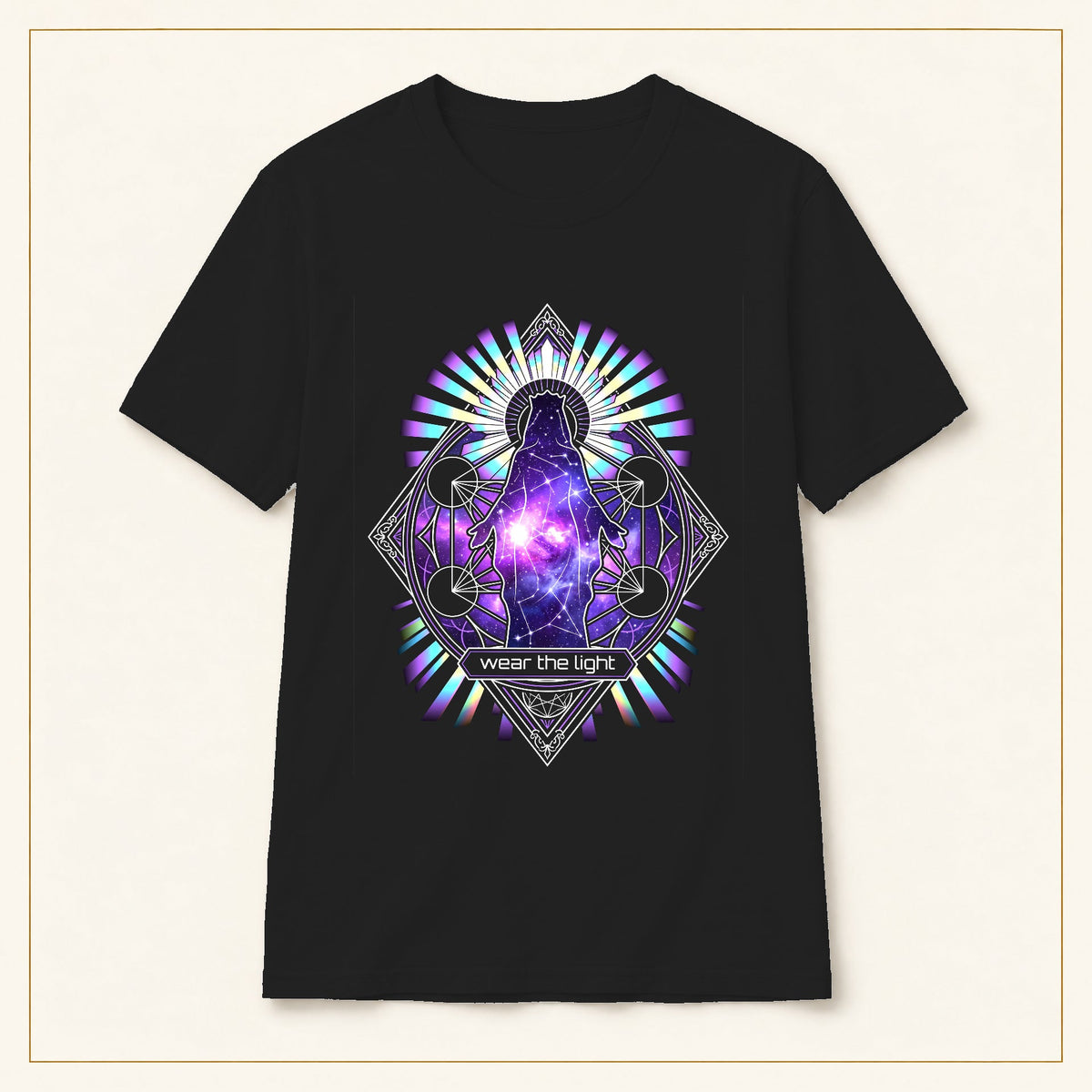 Cosmic Geometry T-Shirt — Wear the Light — black shirt on warm limestone with gold frame